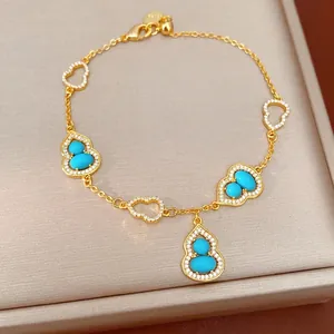 Elegant 18K gold-plated bracelet featuring zircon-encrusted turquoise gourd charms.