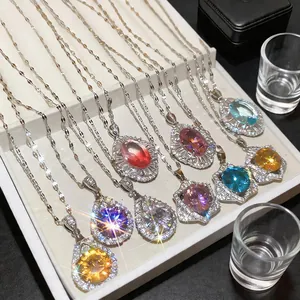 Detailed view of colorful vintage palace style teardrop cubic zirconia necklaces.