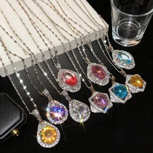Detailed showcase of multiple vintage court style teardrop zircon necklaces in vibrant colors.
