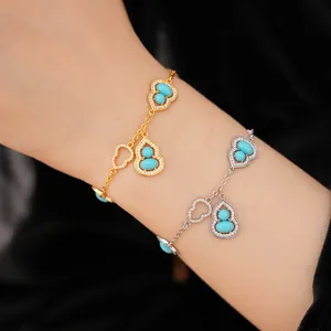 Close-up view of 18K gold and silver hulu bracelets with turquoise beads and pavé zircons.