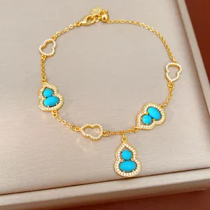 Close-up detail of 18K gold plated calabash bracelet with blue stones and zircons