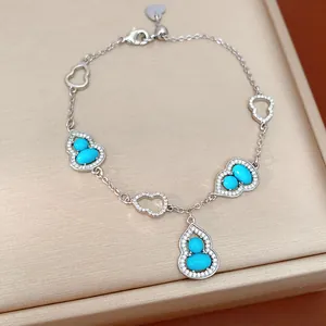 Elegant 18K gold plated bracelet with turquoise-colored hulu charms and pavé zircons