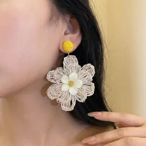 Large handmade woven raffia flower pendant earrings for bohemian vacation style