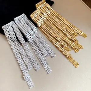 Elegant long silver needle asymmetric tassel earrings in gold and silver finish