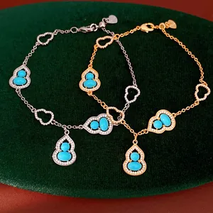 Detail view of 18K gold plated gourd bracelets with turquoise and zircons