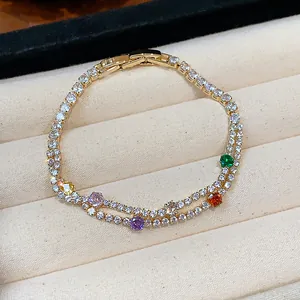 Detailed view of 18k gold-plated bracelet with multi-colored cubic zirconia stones