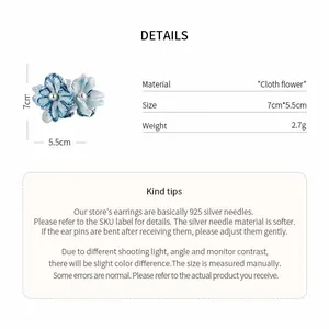 Detailed view of blue cloth flower earrings with 7cm size and material specifications