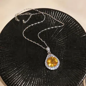 Elegant vintage palace style necklace featuring a yellow teardrop zircon pendant on black plate