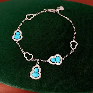 Detailed view of 18K gold plated gourd bracelet with turquoise stones and zircons