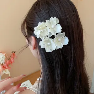Elegant white fabric flower hair clip with pearl center, beach style hair accessory for women