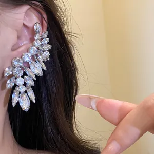 Close-up of sparkling rhinestone ear crawler earring showing elegant marquise-cut details