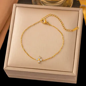 Elegant 18k gold plated bracelet featuring a sparkling four-leaf flower zircon pendant