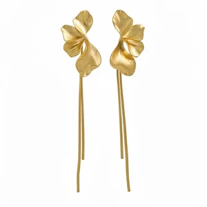 Elegant gold flower tassel drop earrings with sleek metallic finish and long fringes
