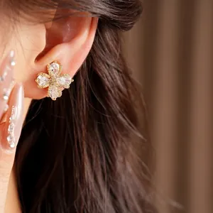 Elegant gold plated flower clip-on earrings with cubic zirconia for non-pierced ears