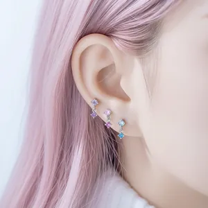 Sweet zircon dangling stud earrings with colorful square stones on model's ear