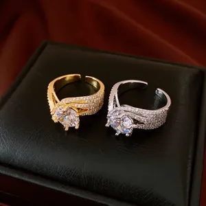 Detailed macro view of luxury gold and silver twisted rings with large zircon stones