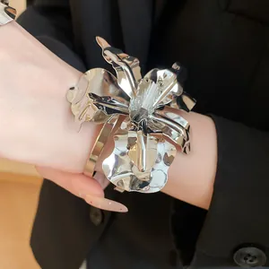 Detailed view of large metallic silver orchid flower cuff bracelet for women jewelry