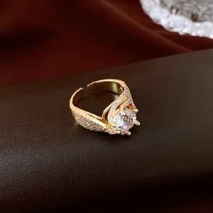 Detailed view of a luxury gold-plated open ring with a round zircon centerpiece.