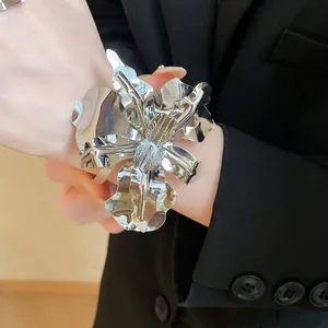 Statement metallic silver flower cuff bracelet featuring 3D sculpted layered petals
