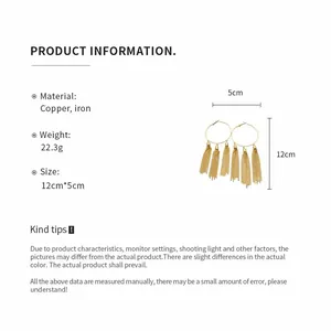 Detail view of retro gold tassel hoop earrings with 12cm length and 5cm width measurements.