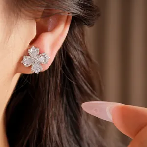 Detailed close-up showing sparkling zircon flower clip-on earring for non-pierced ears