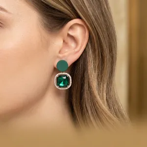 Elegant emerald green rhinestone stud earrings with silver needles for a luxury look