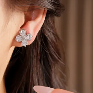 Close-up of elegant flower clip-on earrings with sparkling cubic zirconia detail