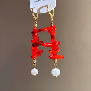 Elegant vintage red resin coral-style tassel earrings featuring white pearl drop details