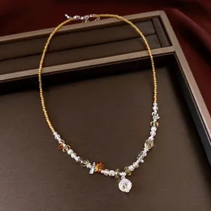 Vintage beaded necklace with crystal stones and a transparent flower pendant
