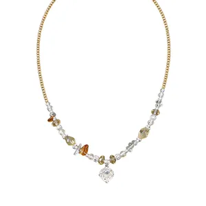 Vintage gold beaded necklace with amber stones and a clear zircon flower pendant