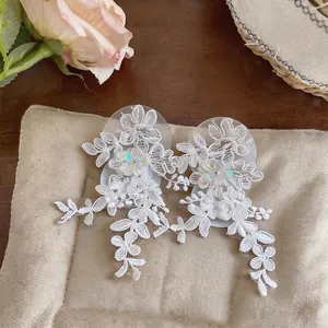 Elegant white lace flower tassel earrings with delicate embroidery and bead details