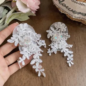 Elegant white lace flower tassel earrings with shimmering sequin details