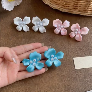Elegant pearl flower stud earrings in matte white pink and blue colors