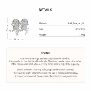 Detailed size and material info for white lace floral drop earrings in French style.