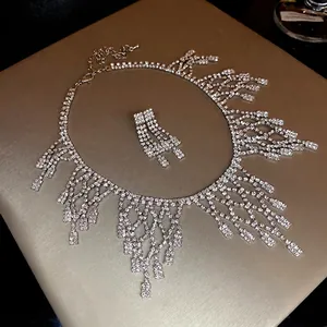 Exaggerated rhinestone fringe necklace and earrings set with luxury sparkling crystals