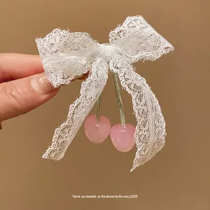 Elegant white lace bow hair clip with pink cherry pendants, sweet hair accessory