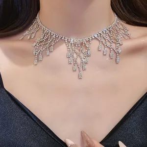 Elegant close-up view of a sparkling silver-tone rhinestone fringe choker necklace on a model