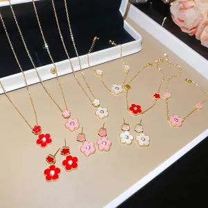 Elegant gold-plated flower jewelry set featuring zircon necklaces, bracelets and earrings.