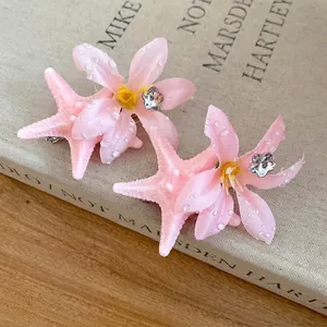 Romantic pink starfish hair clips with flower petals for summer beach vacation