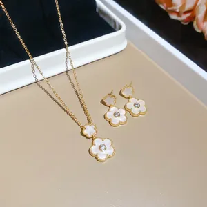 Elegant gold plated white enamel flower pendant necklace and earrings set with zircon