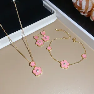Detailed view of the gold-plated pink flower jewelry set featuring zircon accents