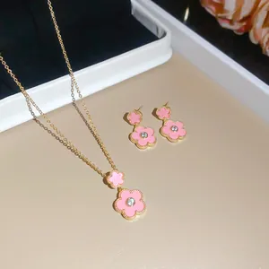 Detail view of pink zircon flower pendant necklace and matching stud earrings set