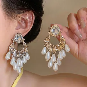 Elegant statement oval crystal stud earrings with dangling teardrop pearl tassel