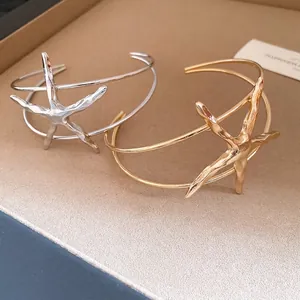 Elegant gold and silver starfish cuff bracelets for women with a vintage metal design