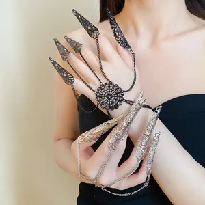 Detailed view of Gothic filigree finger armor bracelets in black and silver finishes.
