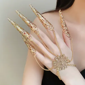 Detailed macro view of an intricate golden hollow-out claw finger harness bracelet.