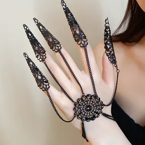Detailed view of the intricate black lace patterns on the gothic finger claw harness