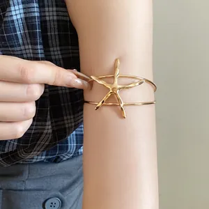 Gold starfish arm cuff bangle for women, chic minimalist oceanic style upper arm jewelry