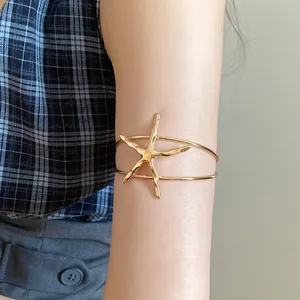 Gold metal starfish open upper arm cuff bracelet with a vintage fashion design for women