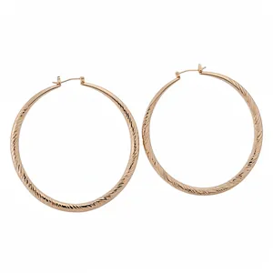 Elegant rose gold hoop earrings with textured cut-surface geometric design for women